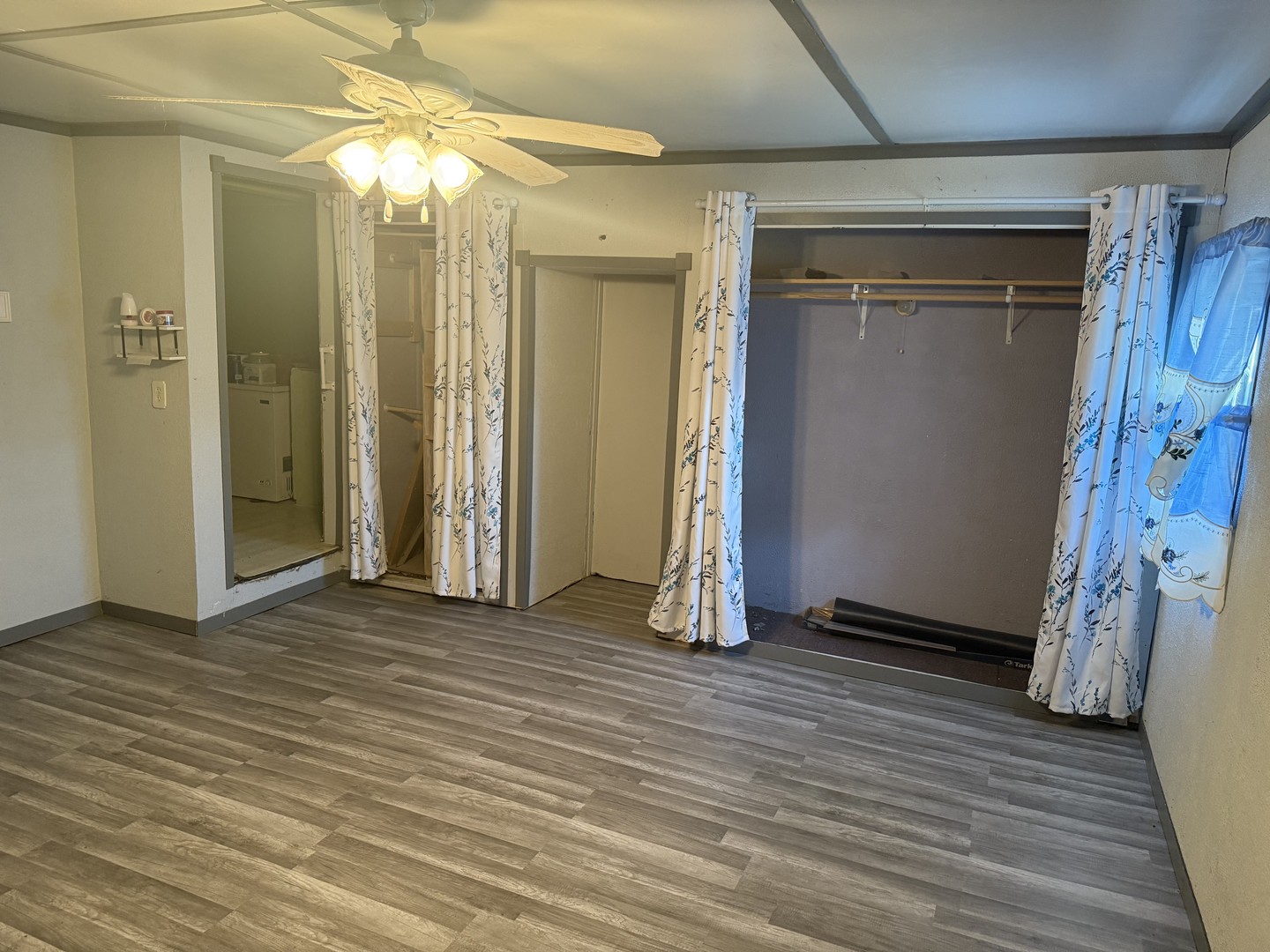 309 South Main Street Elliott, IL 60933 - Photo 27 of 44 a view of an empty room with wooden floor and a bathroom