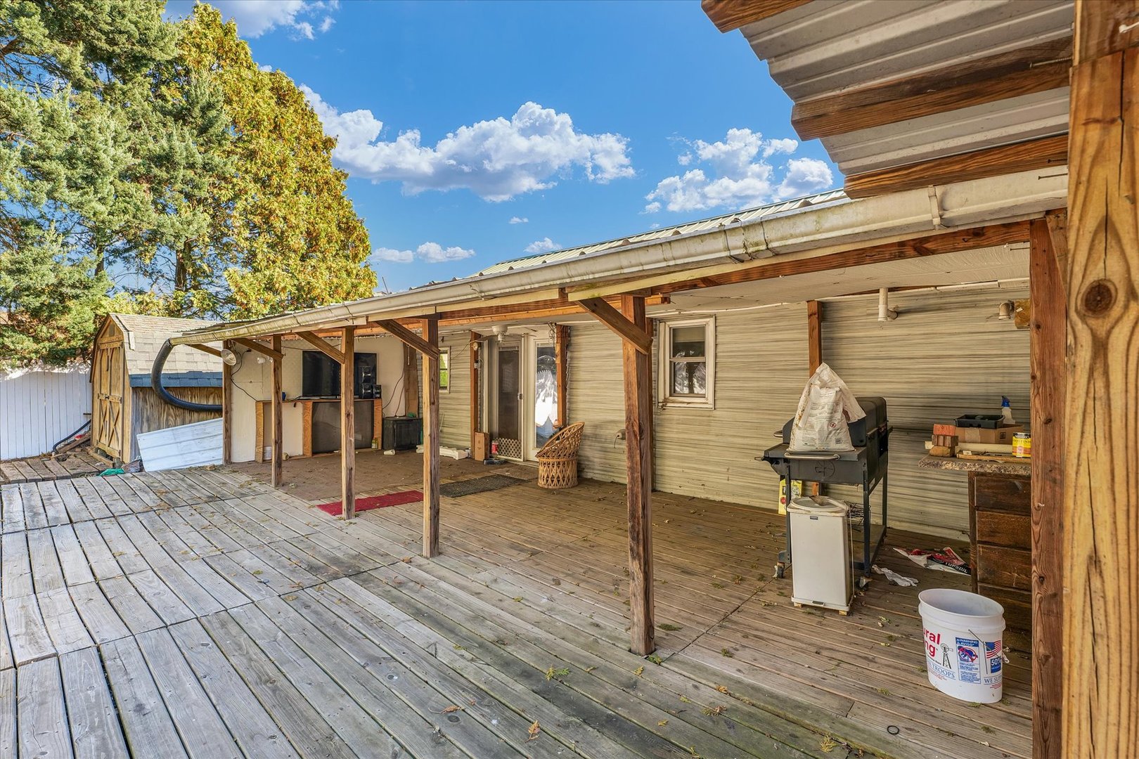 309 South Main Street Elliott, IL 60933 - Photo 4 of 44 a view of a house with wooden deck