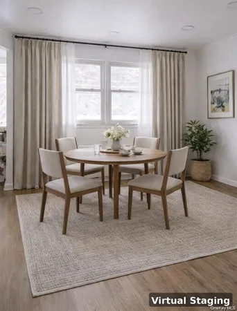 a view of a dining room with furniture and window