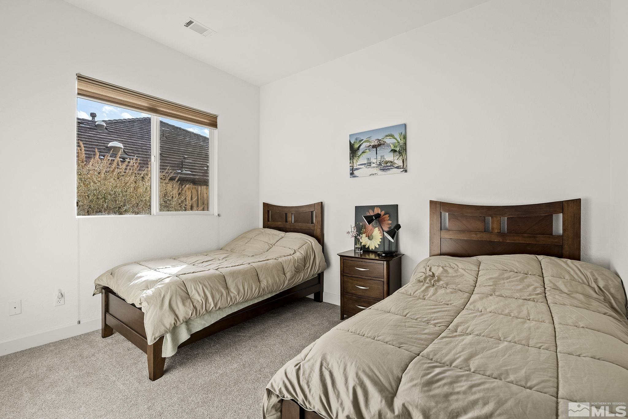 1455 Meridian Ranch Drive Reno, NV 89523 - Photo 18 of 33 a bedroom with two beds and a large window