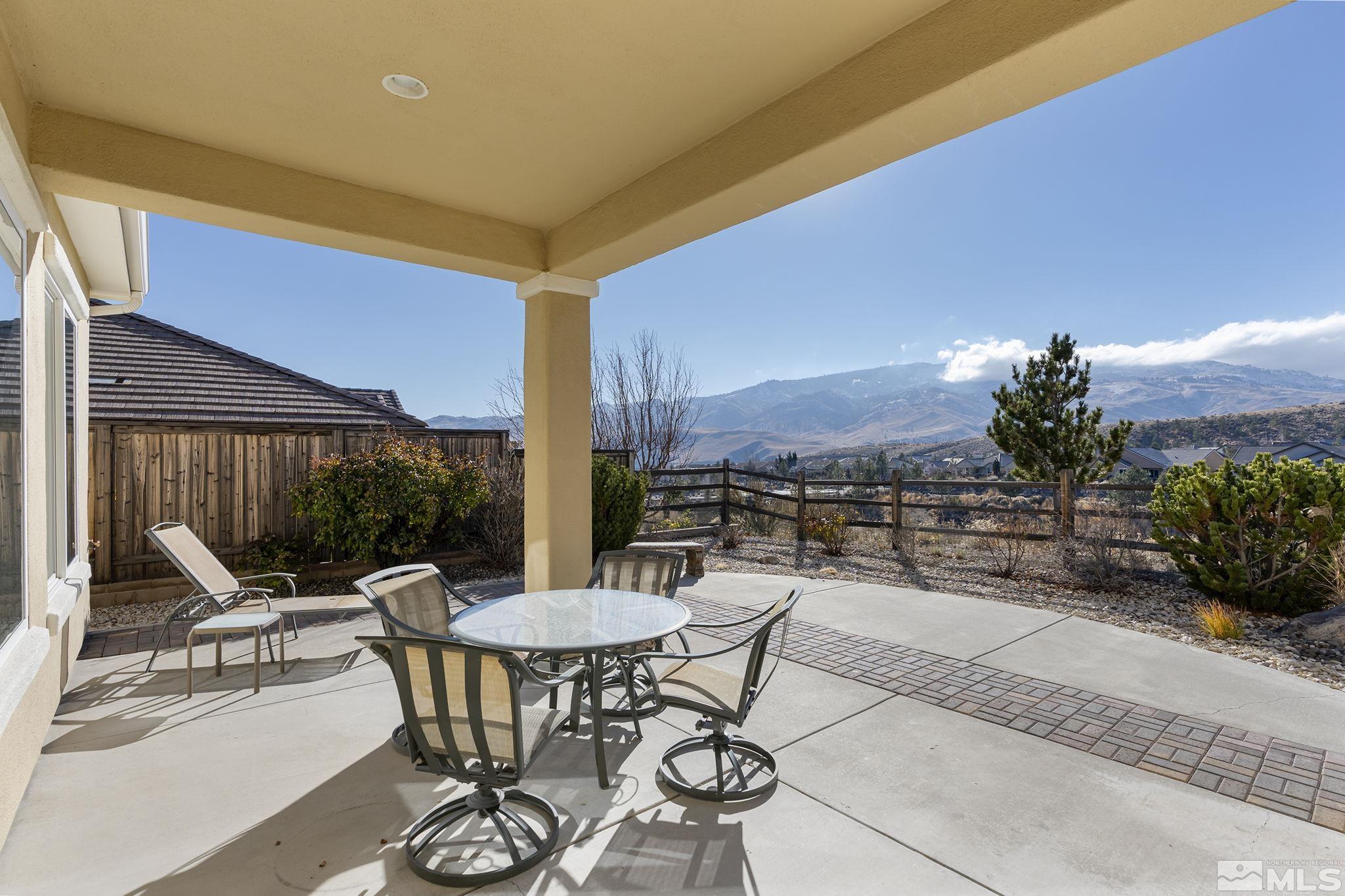 1455 Meridian Ranch Drive Reno, NV 89523 - Photo 23 of 33 a view of a patio with a table and chairs and potted plants