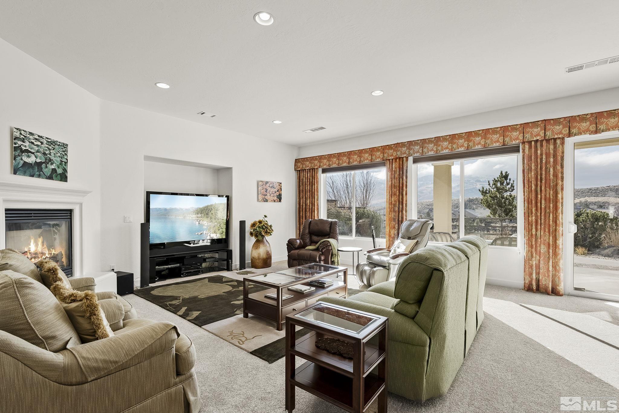 1455 Meridian Ranch Drive Reno, NV 89523 - Photo 4 of 33 a living room with furniture and a flat screen tv