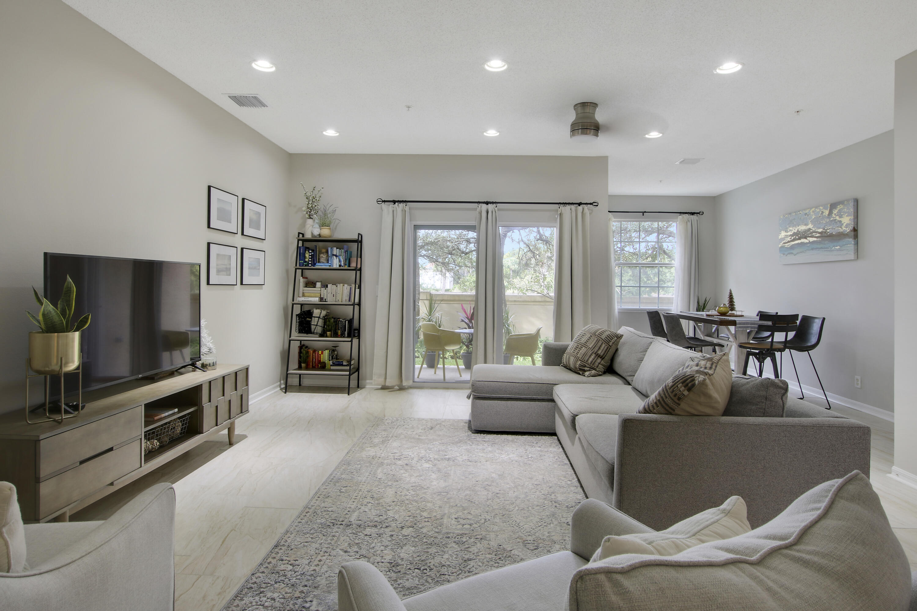 115 Lighthouse Circle, Unit D Tequesta, FL 33469 - Photo 11 of 28 a living room with furniture and a flat screen tv