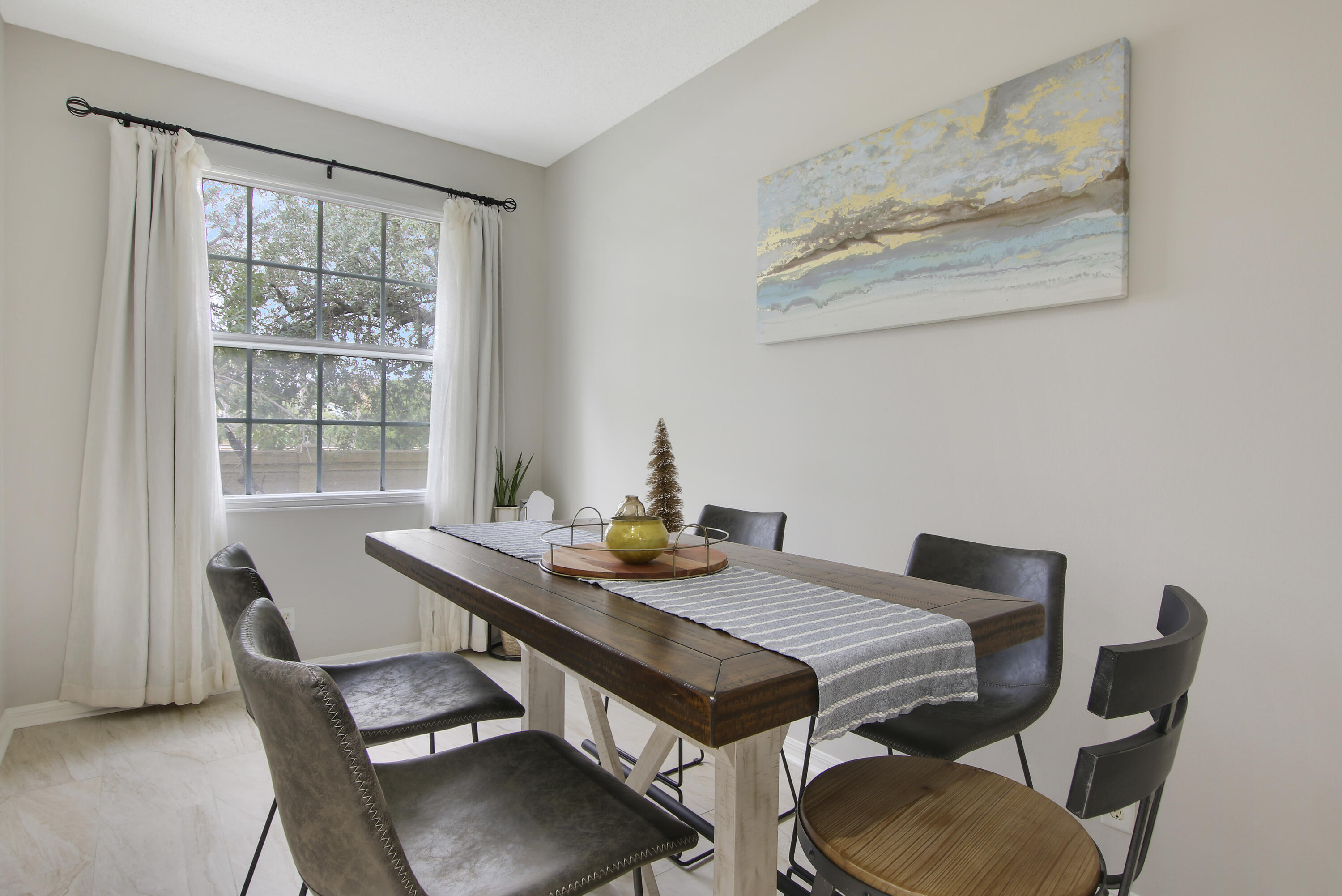 115 Lighthouse Circle, Unit D Tequesta, FL 33469 - Photo 13 of 28 a view of a dining room with furniture window and outside view