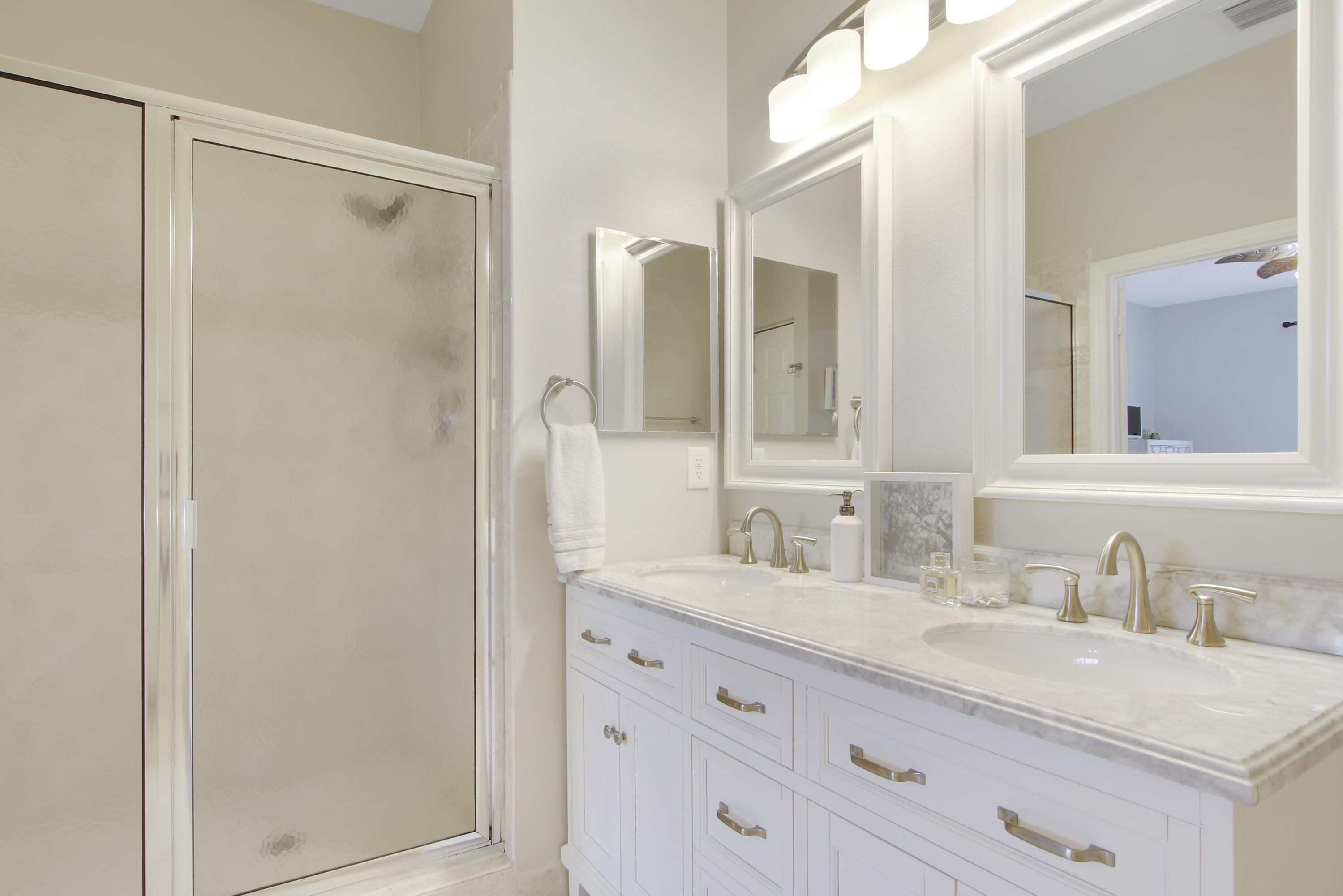 115 Lighthouse Circle, Unit D Tequesta, FL 33469 - Photo 23 of 28 a bathroom with a granite countertop sink mirror and double