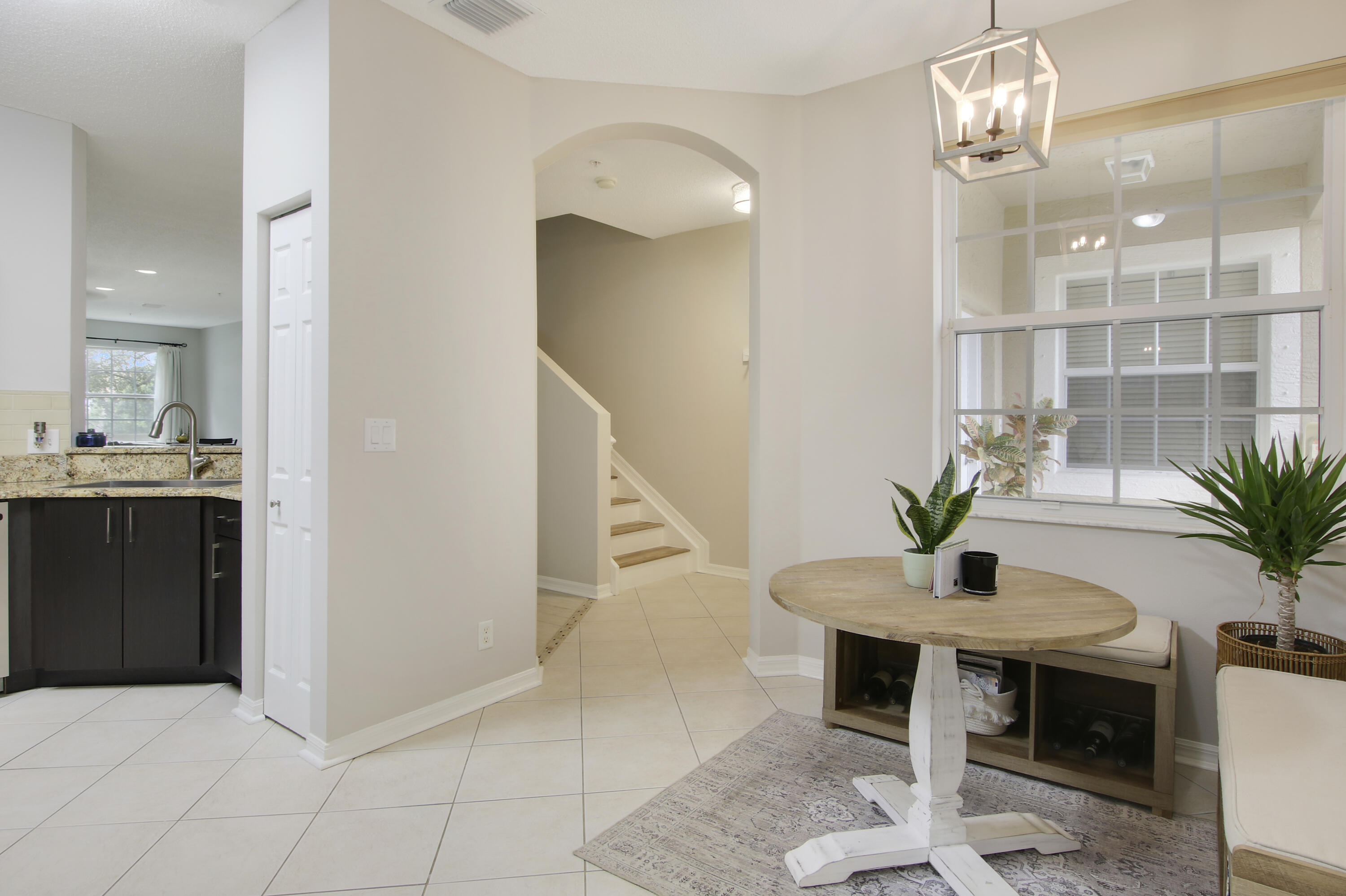 115 Lighthouse Circle, Unit D Tequesta, FL 33469 - Photo 6 of 28 a view of a livingroom with furniture and a potted plant