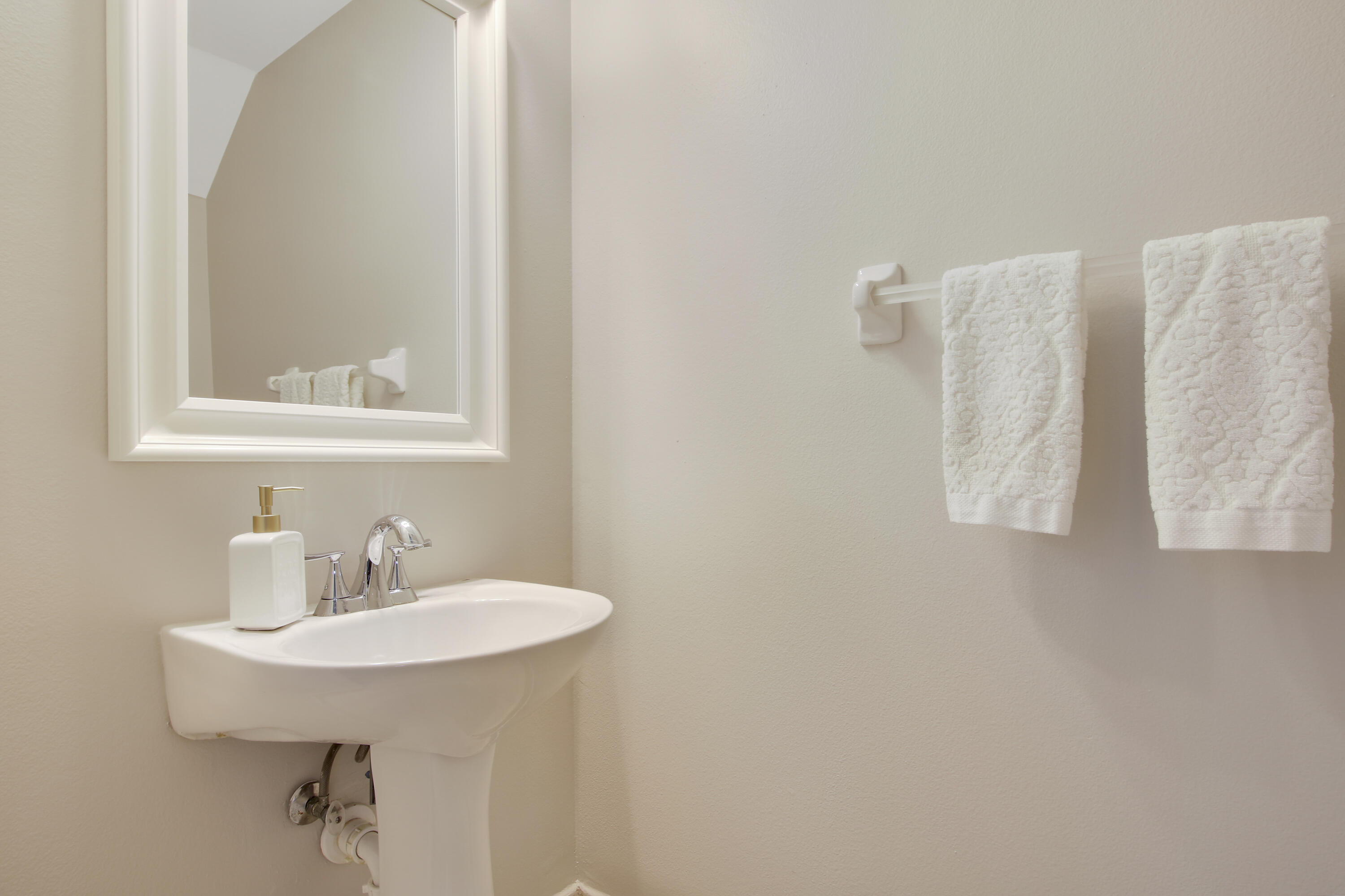 115 Lighthouse Circle, Unit D Tequesta, FL 33469 - Photo 10 of 28 a bathroom with a sink and a mirror