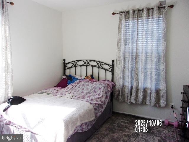 11612 Neon Road Fort Washington, MD 20744 - Photo 23 of 75 a bedroom with a bed and a window