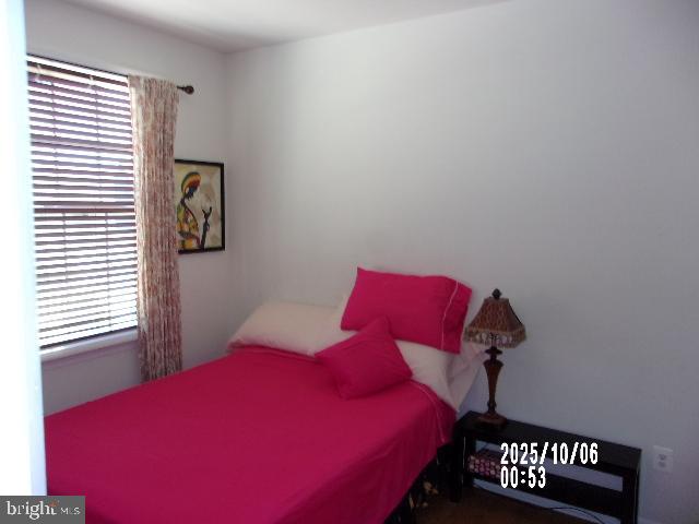 11612 Neon Road Fort Washington, MD 20744 - Photo 25 of 75 a bedroom with a bed and wooden floor