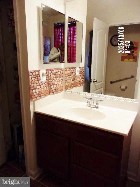 11612 Neon Road Fort Washington, MD 20744 - Photo 43 of 75 a bathroom with a sink and a mirror