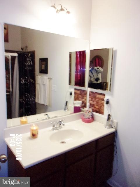 11612 Neon Road Fort Washington, MD 20744 - Photo 44 of 75 a bathroom with a sink and a mirror