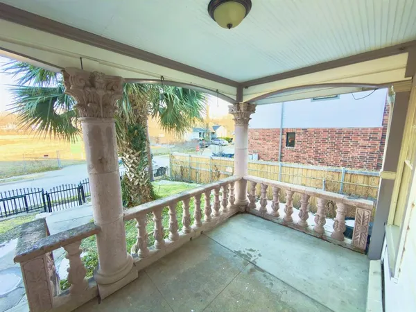 a view of a porch with a furniture
