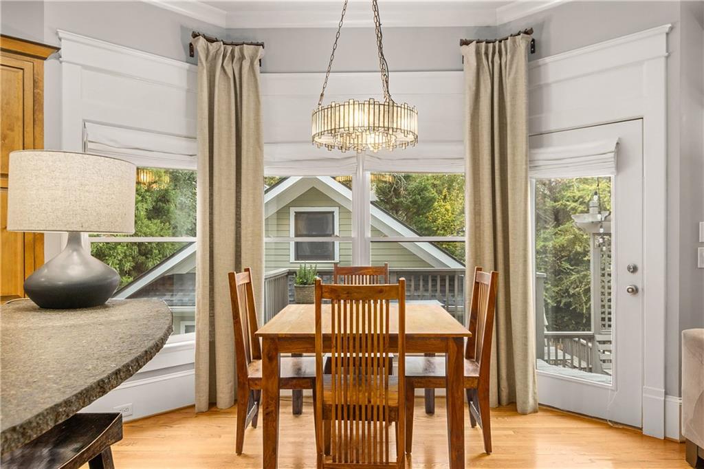 280 Sutherland Place Northeast Atlanta, GA 30307 - Photo 15 of 66 a view of a livingroom with furniture wooden floor a chandelier