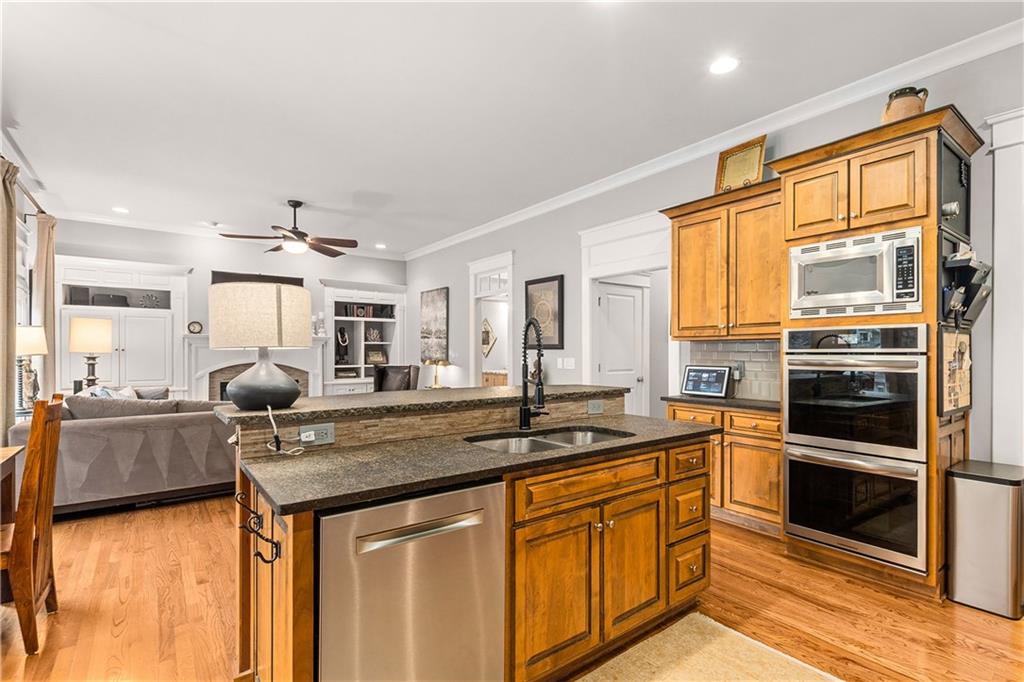 280 Sutherland Place Northeast Atlanta, GA 30307 - Photo 19 of 66 a kitchen with stainless steel appliances granite countertop a sink stove and refrigerator