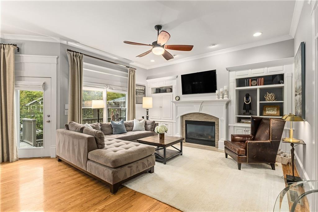 280 Sutherland Place Northeast Atlanta, GA 30307 - Photo 22 of 66 a living room with furniture fireplace and flat screen tv