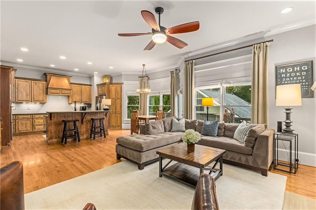 280 Sutherland Place Northeast Atlanta, GA 30307 - Photo 23 of 66 a living room with furniture kitchen area and a large window
