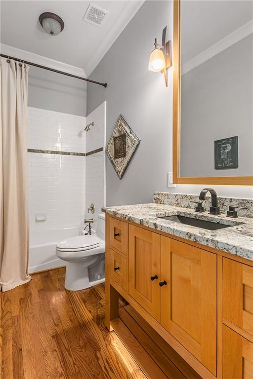 280 Sutherland Place Northeast Atlanta, GA 30307 - Photo 24 of 66 a bathroom with a granite countertop sink mirror vanity and toilet