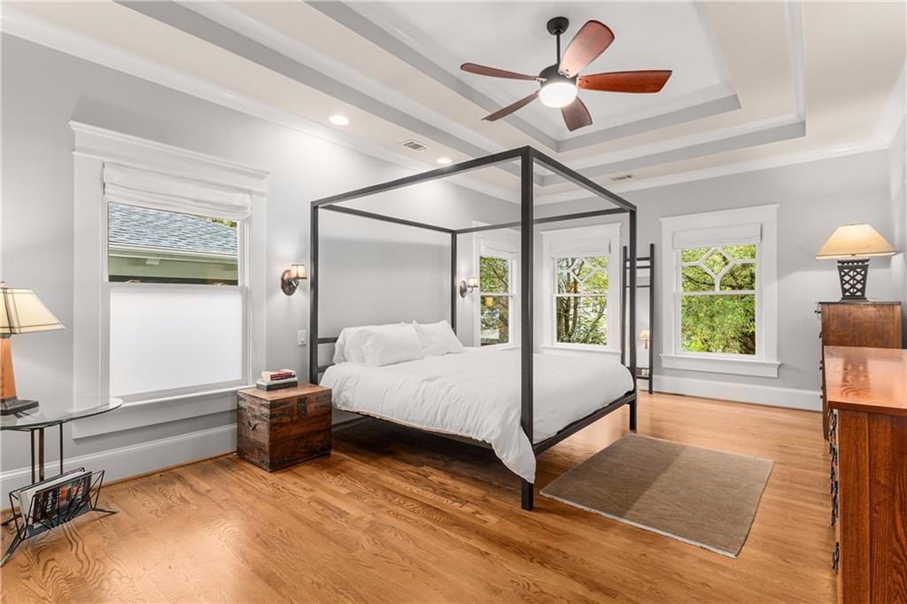 280 Sutherland Place Northeast Atlanta, GA 30307 - Photo 26 of 66 a bedroom with a bed and a chandelier