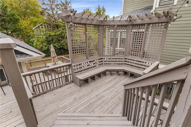 a bedroom with a bed and dresser with mirror