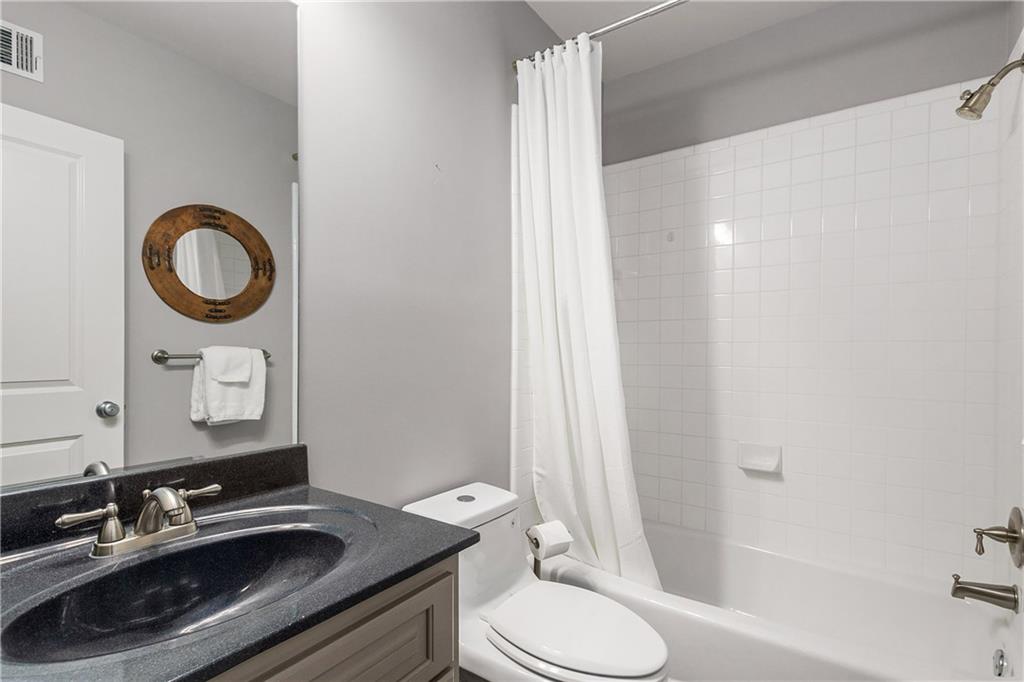 280 Sutherland Place Northeast Atlanta, GA 30307 - Photo 40 of 66 a bathroom with a sink a toilet and shower