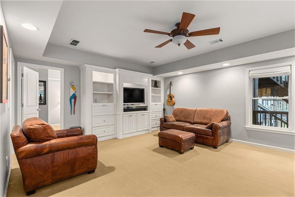 280 Sutherland Place Northeast Atlanta, GA 30307 - Photo 42 of 66 a living room with furniture and a flat screen tv