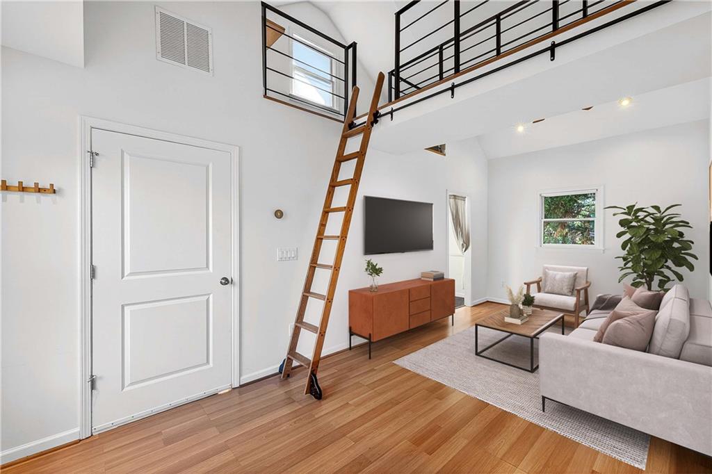 280 Sutherland Place Northeast Atlanta, GA 30307 - Photo 49 of 66 a living room with furniture and a flat screen tv