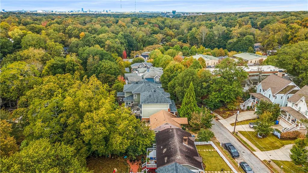 280 Sutherland Place Northeast Atlanta, GA 30307 - Photo 61 of 66 an aerial view of a house with a yard