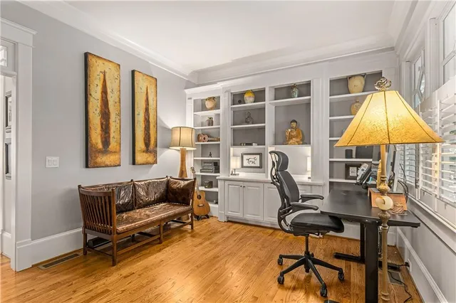 a view of a dining room with furniture window and wooden floor