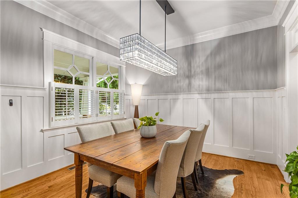 280 Sutherland Place Northeast Atlanta, GA 30307 - Photo 10 of 66 a view of a dining room with furniture window and wooden floor