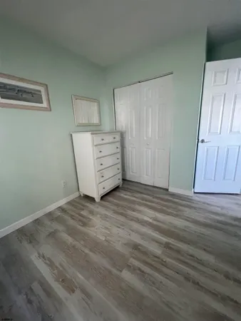 a view of a closet in wooden floor