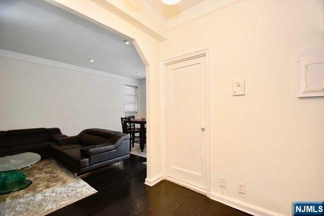 985 Teaneck Road, Unit 1J Teaneck, NJ 07666 - Photo 3 of 10 a living room with furniture