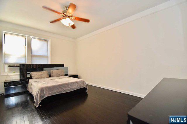 985 Teaneck Road, Unit 1J Teaneck, NJ 07666 - Photo 8 of 10 a bedroom with a bed and a window