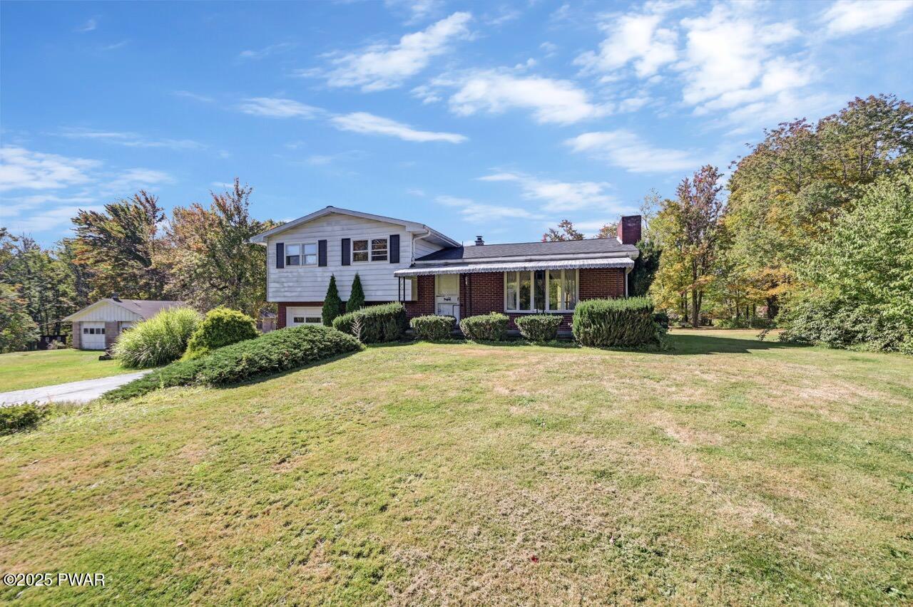 100 Spring Hill Road Moscow, PA 18444 - Photo 11 of 101 a front view of a house with a yard