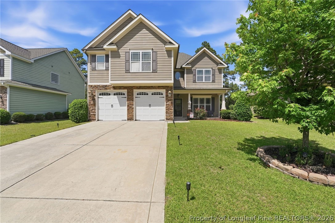 886 Micahs Way North Spring Lake, NC 28390 - Photo 1 of 50 a front view of a house with a yard