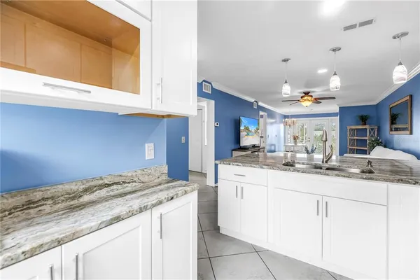 a kitchen with a sink and cabinets