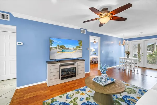 a living room with furniture a rug and a fireplace