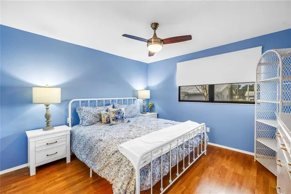 a bedroom with a bed and a night stand