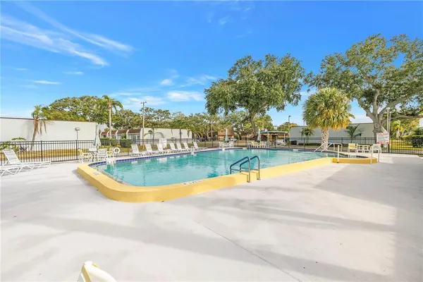 a view of a swimming pool and a yard