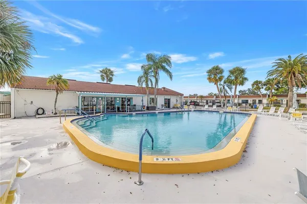 a view of a swimming pool with a patio