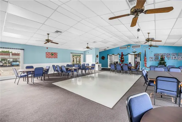 a living room with lots of furniture and a chandelier