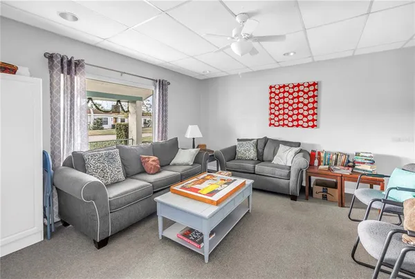 a living room with furniture and a window
