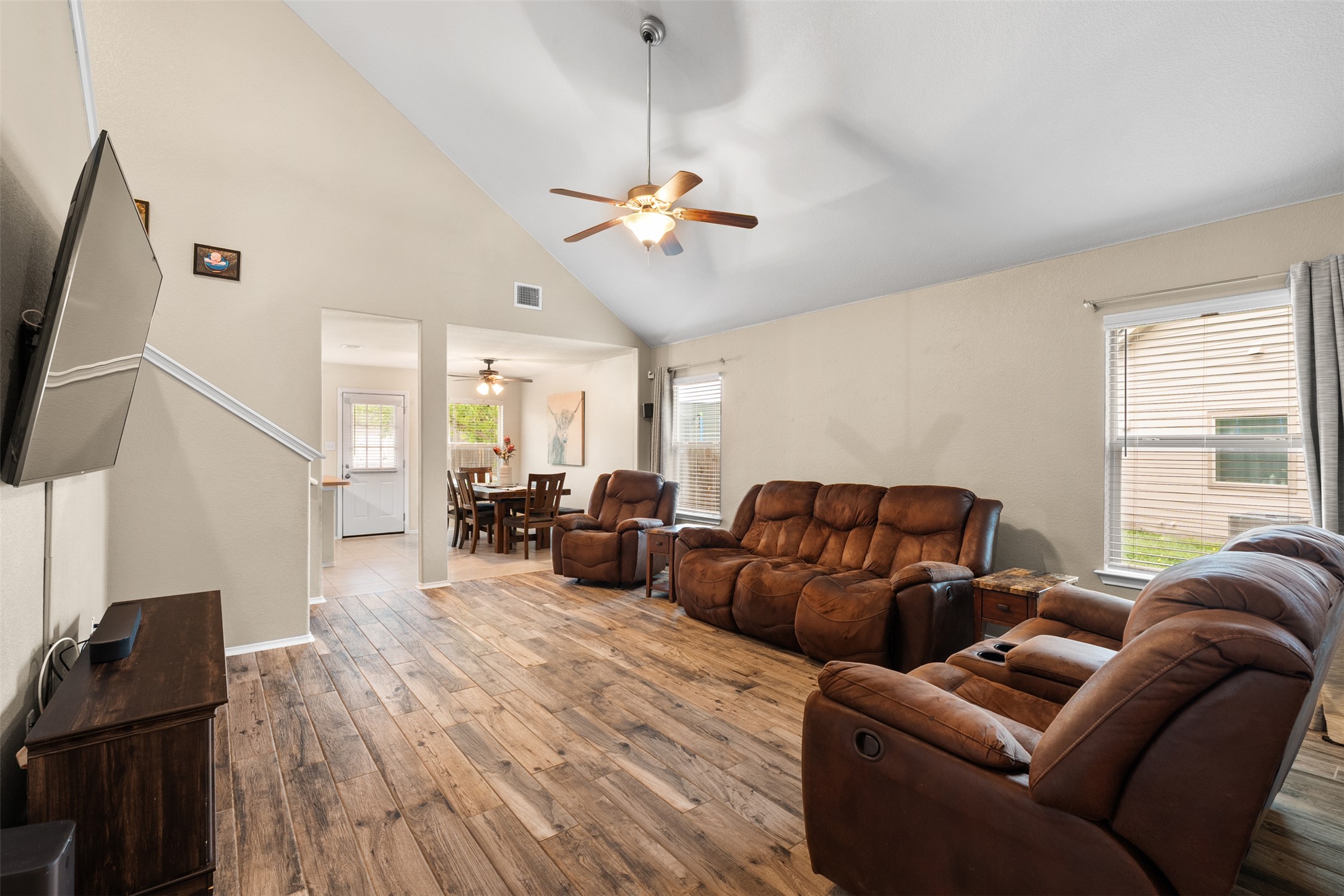 137 Barn Owl Loop Leander, TX 78641 - Photo 9 of 36 a living room with furniture a ceiling fan and a window