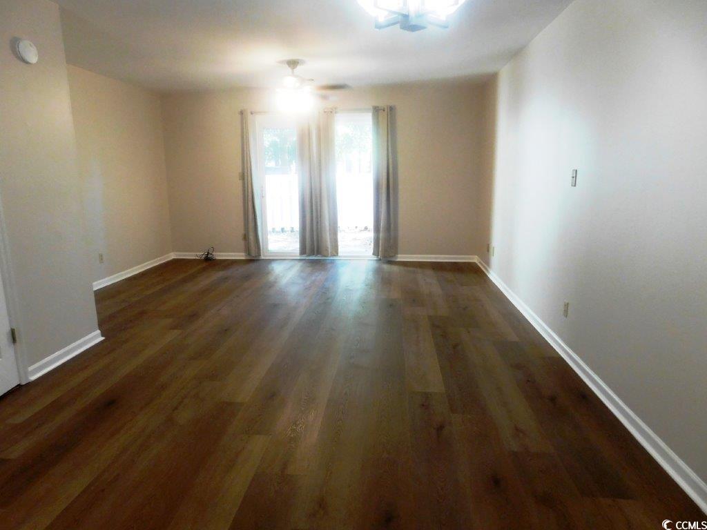 1025 Carolina Road, Unit FF3 Conway, SC 29526 - Photo 4 of 16 Unfurnished room featuring ceiling fan and dark ha