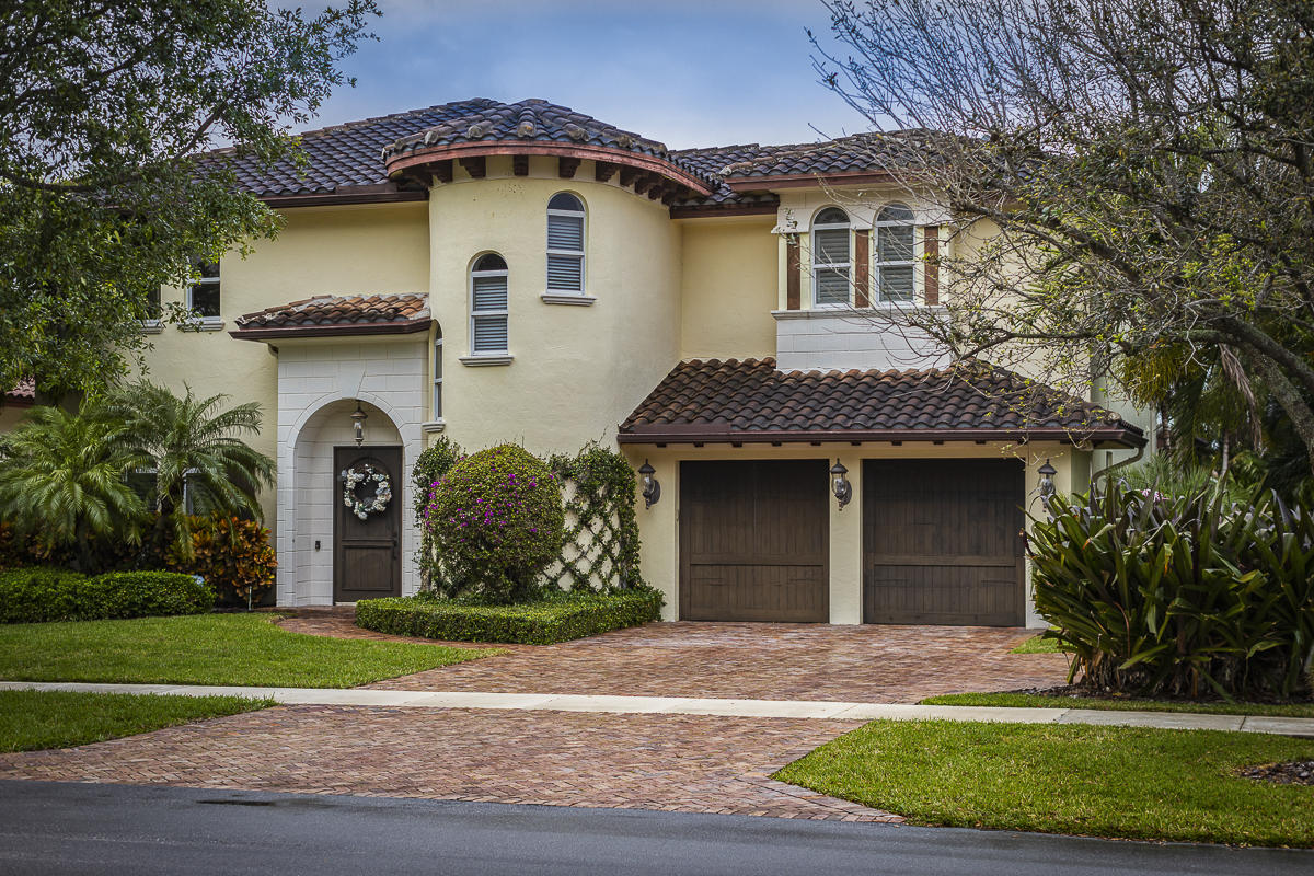 1301 Southwest 16th Street Boca Raton, FL 33486 - Photo 1 of 57 a front view of a house with garden