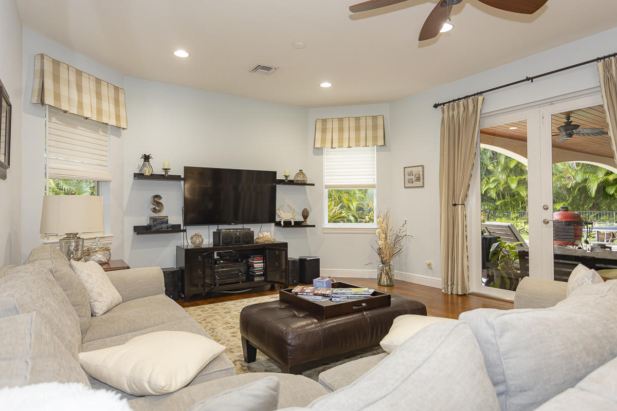 1301 Southwest 16th Street Boca Raton, FL 33486 - Photo 13 of 57 a living room with furniture and a flat screen tv