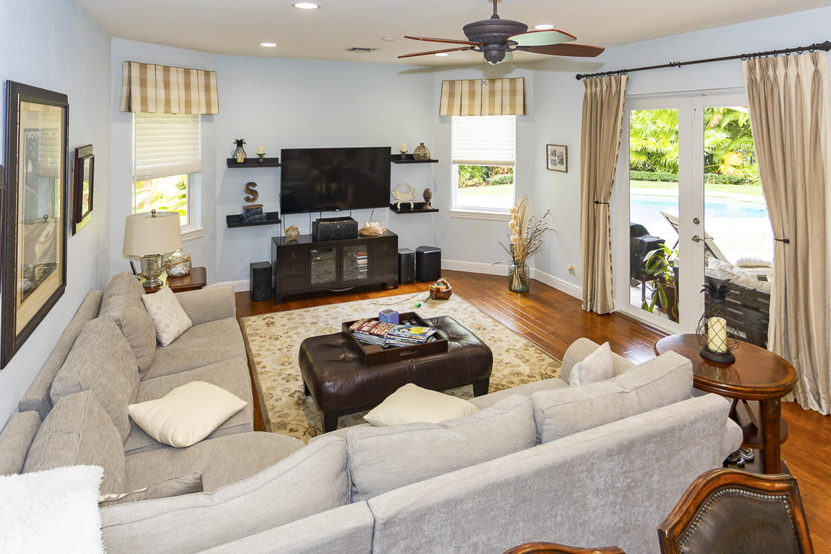 1301 Southwest 16th Street Boca Raton, FL 33486 - Photo 14 of 57 a living room with furniture and a flat screen tv