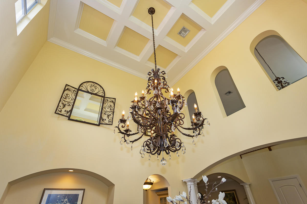 1301 Southwest 16th Street Boca Raton, FL 33486 - Photo 18 of 57 a view of a chandelier fan and wooden floor