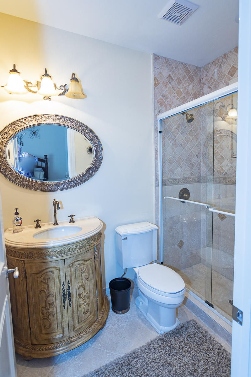 1301 Southwest 16th Street Boca Raton, FL 33486 - Photo 24 of 57 a bathroom with a sink toilet and shower