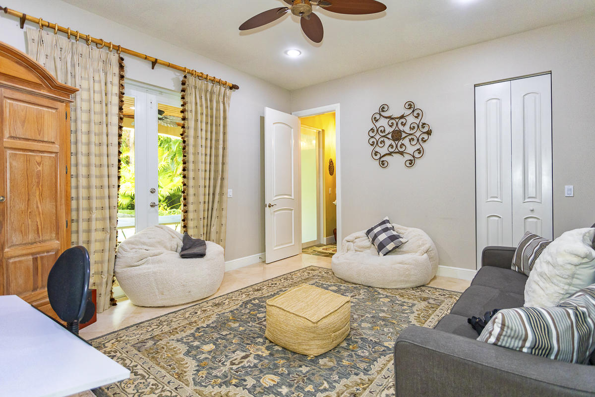 1301 Southwest 16th Street Boca Raton, FL 33486 - Photo 25 of 57 a living room with furniture and a large window