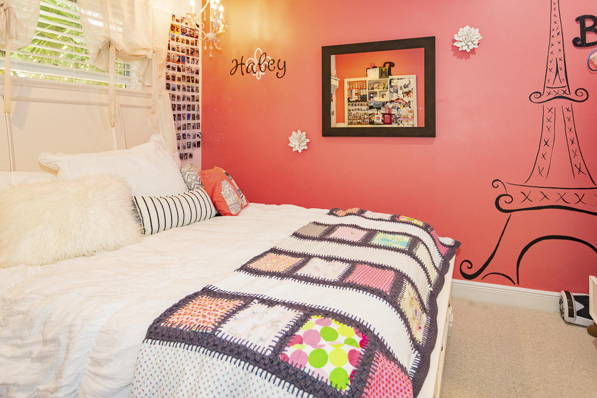 1301 Southwest 16th Street Boca Raton, FL 33486 - Photo 35 of 57 a bedroom with a bed and a painting on the wall